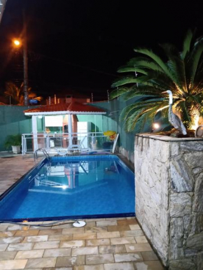 Casa 100mtrs do mar com piscina aquecida
